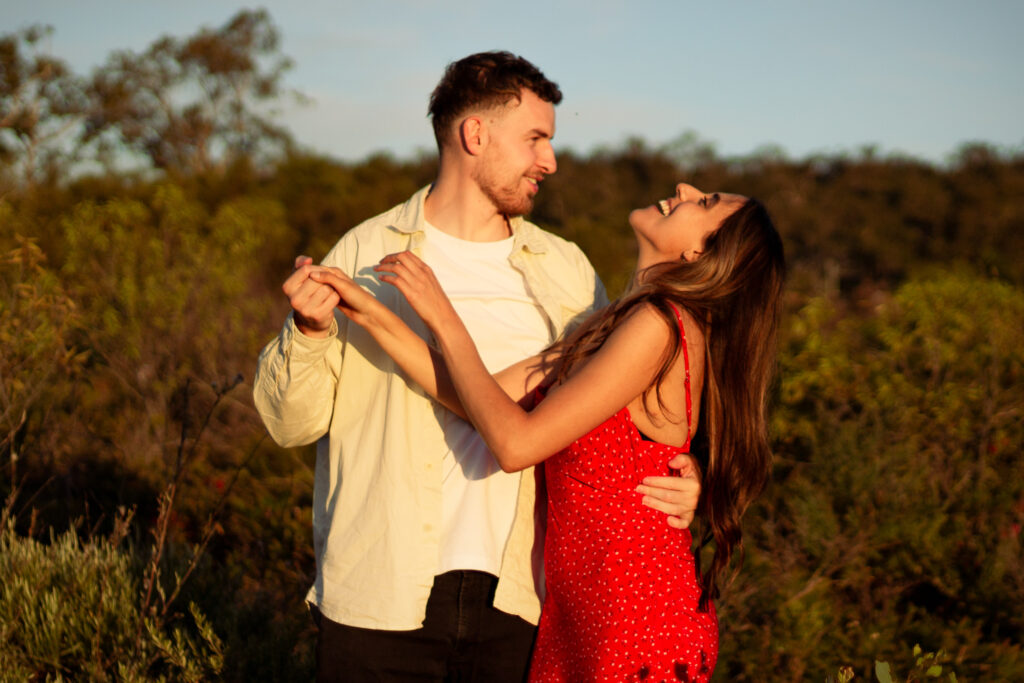 Couple-laughing-together-womans-head-thrown-back-with-multiple-points-connection-between-them